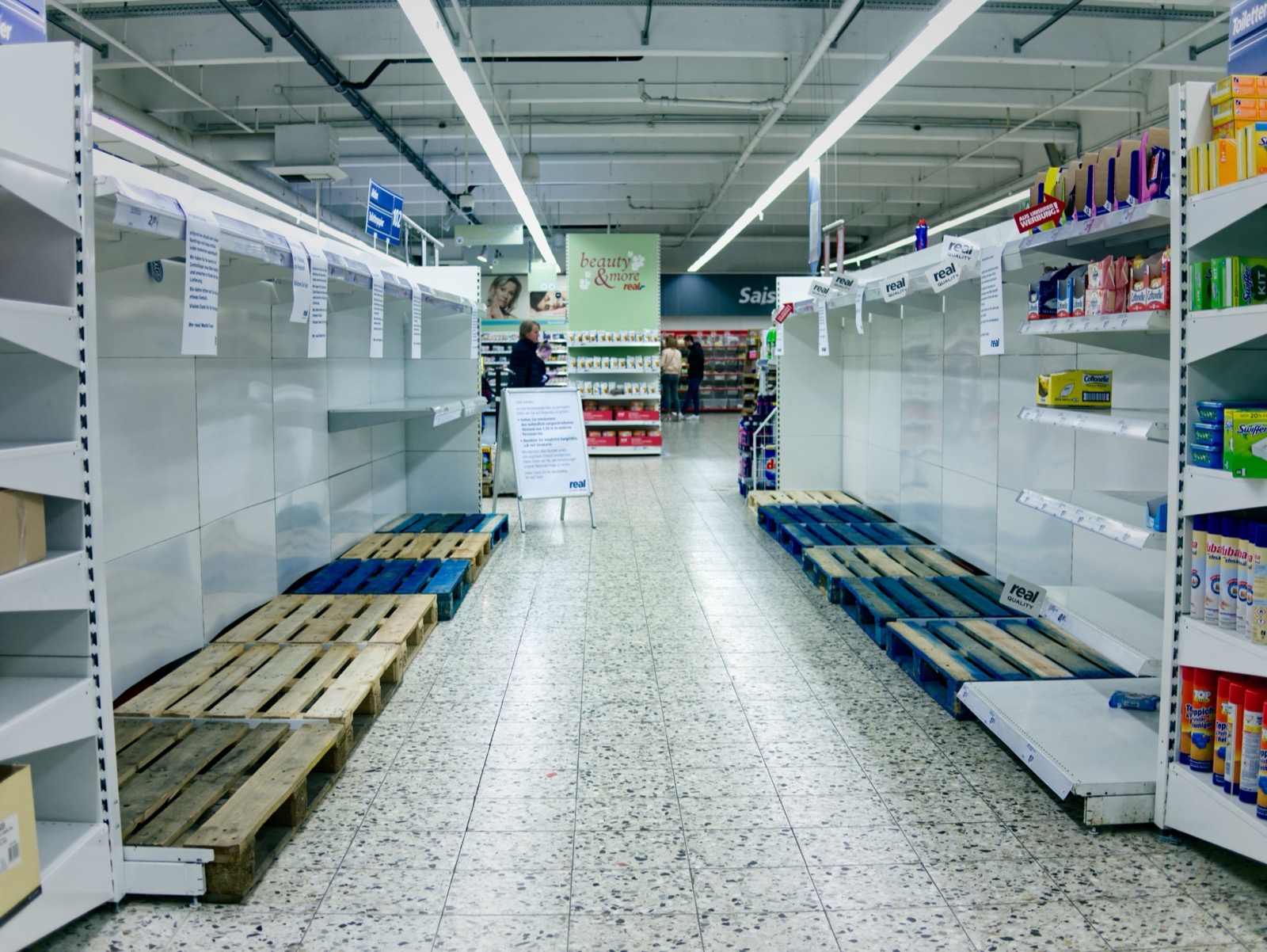 Empty shelves in a grocery aisle