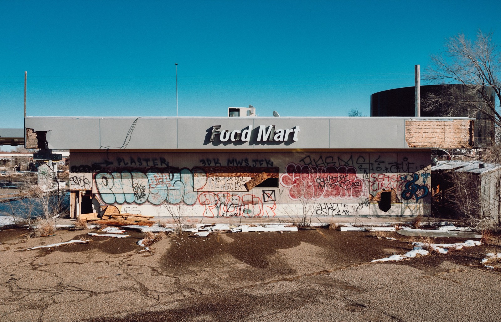 A boarded-up Food Mart